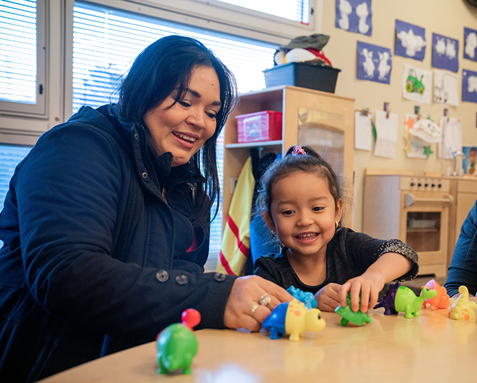 teacher working with young student