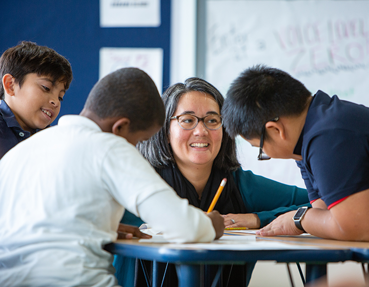 teacher and students working together